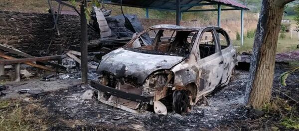 Один из гражданских автомобилей, поврежденных беспилотником противника Один из гражданских автомобилей, поврежденных беспилотником противника - Sputnik Արմենիա