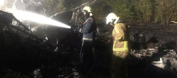 Спасатели работают на месте крушения украинского военного самолета Антонов Ан-26 недалеко от города Чугуев (25 сентября 2020). Украина Спасатели работают на месте крушения украинского военного самолета Антонов Ан-26 недалеко от города Чугуев (25 сентября 2020). Украина - Sputnik Армения