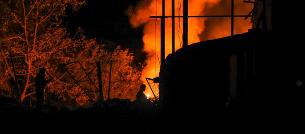Загоревшийся в результате удара ВС Азербайджана хлев частного дома (11 октября 2020). Степанакерт - Sputnik Արմենիա