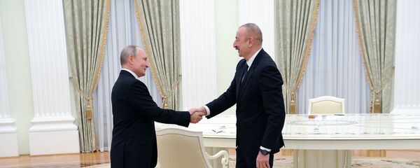 Президенты РФ и Азербайджана Владимир Путин и Ильхам Алиев (справа) перед началом трёхсторонних переговоров по поводу ситуации в Нагорном Карабахе (11 января 2021). Москва - Sputnik Արմենիա
