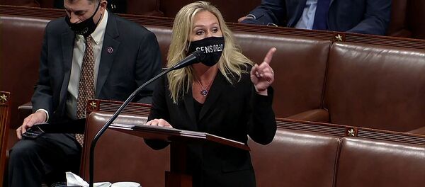 Конгрессмен США Марджори Тейлор Грин выступает во время дебатов в Палате представителей (13 января 2021). Вашингтон Конгрессмен США Марджори Тейлор Грин выступает во время дебатов в Палате представителей (13 января 2021). Вашингтон - Sputnik Армения