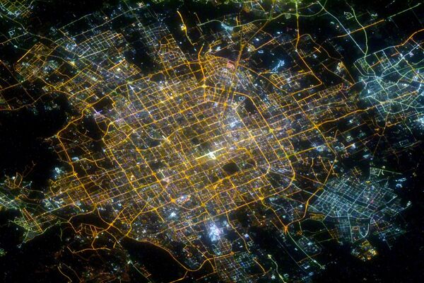 Ночной Пекин, снятый российским космонавтом Сергеем Кудь-Сверчковым с МКС - Sputnik Армения