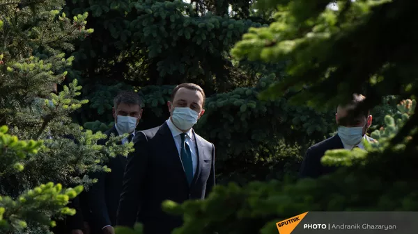 Премьер-министр Грузии Ираклий Гарибашвили во время посещения Мемориала Цицернакаберд (12 мая 2021). Еревaн - Sputnik Армения