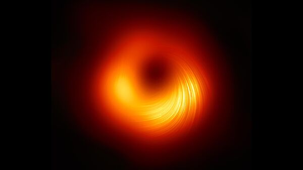 Вид на сверхмассивную черную дыру M87 в поляризованном свете - Sputnik Армения