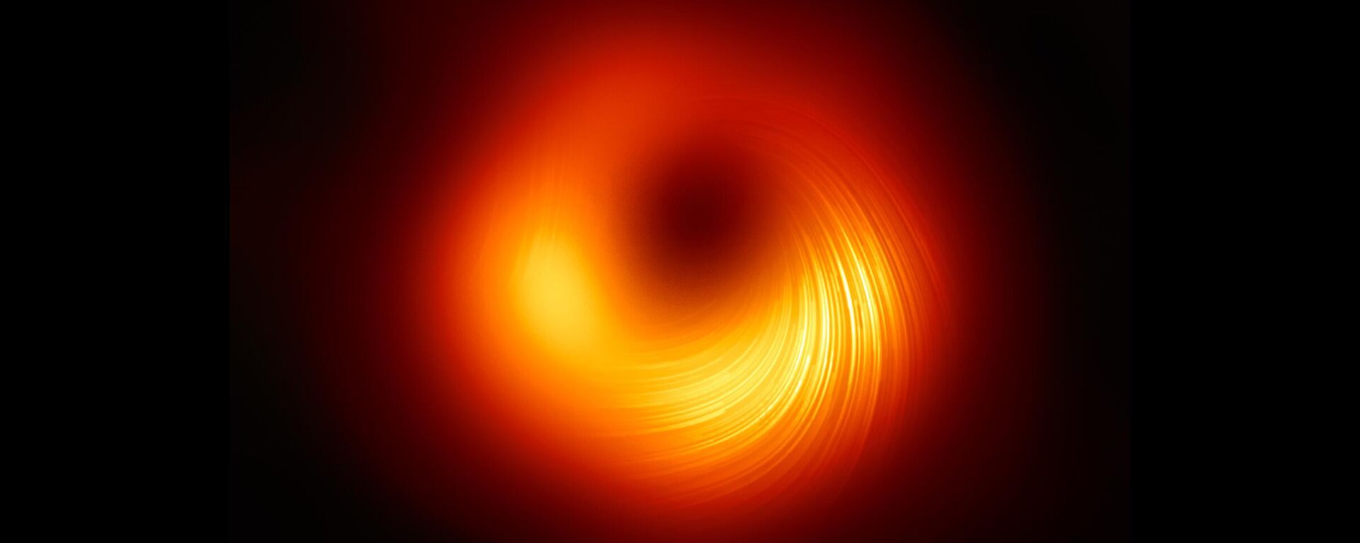 Вид на сверхмассивную черную дыру M87 в поляризованном свете - Sputnik Армения, 1920, 13.05.2022