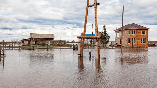 Подтопленные в результате ледохода на реке Лена дома в поселке Едейцы Намского района (23 мая 2022). Якутия - Sputnik Армения
