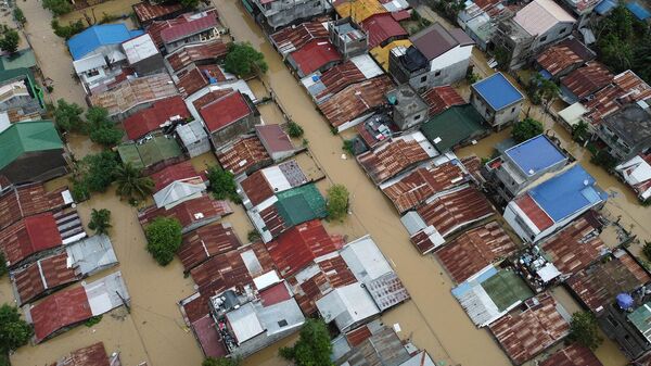 Затопленные дома на Капитолийских холмах в Алибагу, город Илаган, провинция Исабела (31 октября 2022). Филиппины - Sputnik Армения