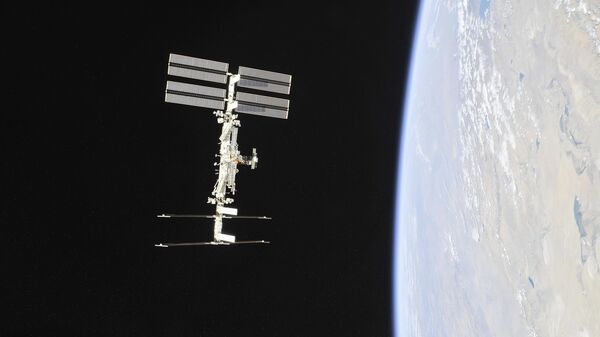 Международная космическая станция на орбите Земли - Sputnik Армения