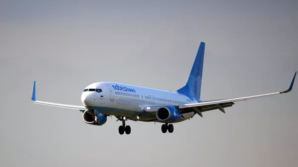 Самолет Boeing 737-800 авиакомпании Победа совершает посадку в аэропорту Внуково (14 июля 2016). Москвa - Sputnik Армения