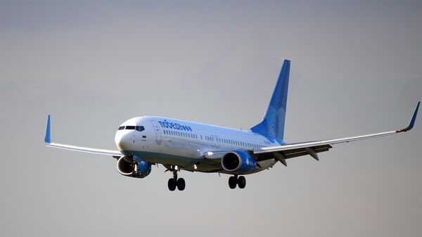 Самолет Boeing 737-800 авиакомпании Победа совершает посадку в аэропорту Внуково (14 июля 2016). Москвa - Sputnik Армения