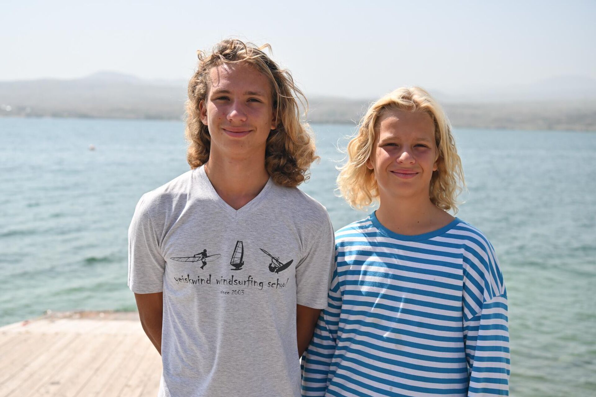 Участники из РФ Максим и Лев Адонины на международном мемориальном турнире по парусному спорту имени адмирала Исакова на озере Севан - Sputnik Армения, 1920, 05.08.2025