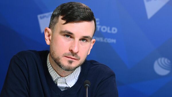 Замдиректора по международному сотрудничеству международного агентства и радио Sputnik Игорь Картавых во время лекции для Пекинского университета (27 октября 2021). Москвa - Sputnik Армения