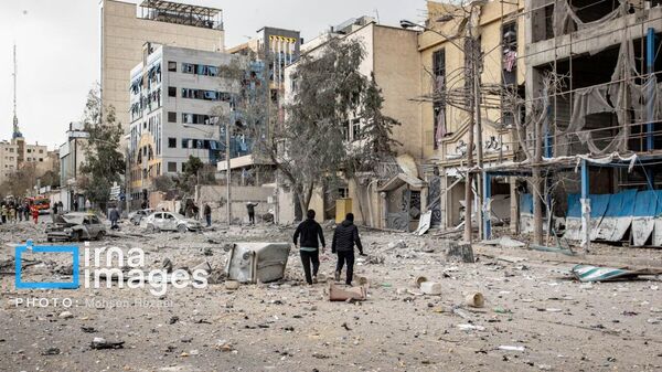 Разрушенные дома и улицы вследствие атак Израиля и США (2 марта 2026). Тегеран - Sputnik Армения