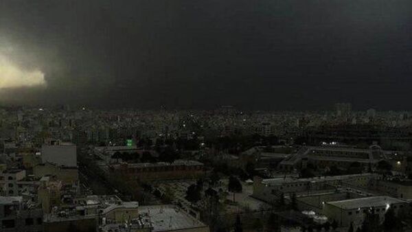 Черный дождь выпал в Тегеране после удара по нефтебазе (9 марта 2026). Иран - Sputnik Армения