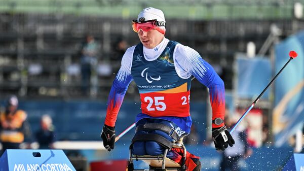 Иван Голубков (Россия) на дистанции спринта в классе LW 10-12 (сидя) среди мужчин на соревнованиях по лыжным гонкам XIV зимних Паралимпийских игр в Валь-ди-Фьемме (11 марта 2026). Италия - Sputnik Армения