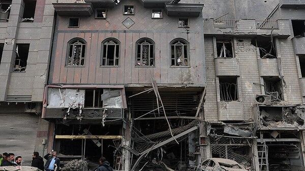 Последствия нападения на площадь мучеников в Тегеране (16 марта 2026). Иран - Sputnik Армения