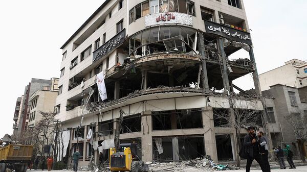 Вид на здание катарского телеканала Al-Araby TV и офисное здание, поврежденные в результате американского удара (29 марта 2026)․ Тегеран - Sputnik Армения
