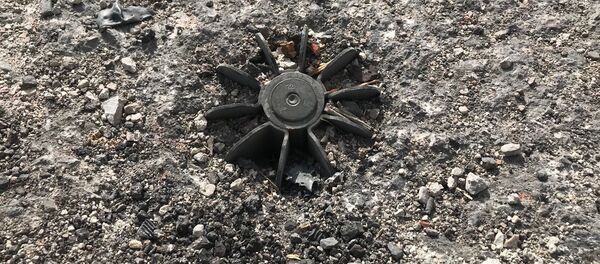 Хвост неразорвавшейся мины в поселении Шефония в Восточной Гуте - Sputnik Армения