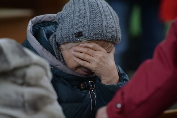 Родственница одного из пропавших без вести при пожаре в торговом центре Зимняя вишня в Кемерово. - Sputnik Армения