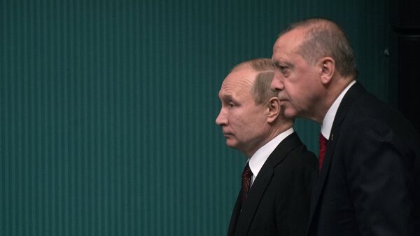 Президенты РФ и Турции Владимир Путин и Реджеп Тайип Эрдоган на церемонии запуска начала строительства первого энергоблока атомной электростанции Аккую (3 апреля 2018). Анкара, Турция - Sputnik Армения