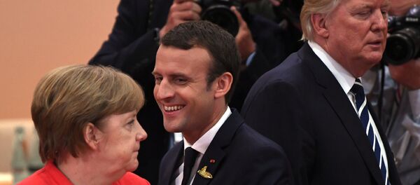 Президент Франции Эммануэль Макрон, канцлер Германии Ангела Меркель и президент США Дональд Трамп во время встречи G20 (7 июля 2017). Гамбург, Германия - Sputnik Армения