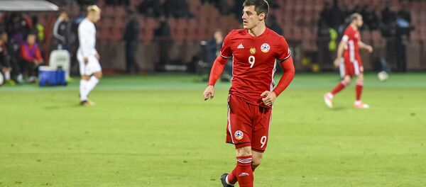 Нападающий сборной Армении по футболу Руслан Короян на матче Польша-Армения (5 октября 2017). Еревaн Нападающий сборной Армении по футболу Руслан Короян на матче Польша-Армения (5 октября 2017). Еревaн - Sputnik Արմենիա