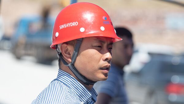 Сотрудник компании Sinohydro на презентации строительных работ автотрассы Север-Юг (18 июля 2018). Арагацотн - Sputnik Արմենիա