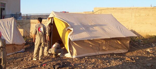 Представители Красного Полумесяца в городе Эс-Сувайда, Сирия Представители Красного Полумесяца в городе Эс-Сувайда, Сирия - Sputnik Արմենիա