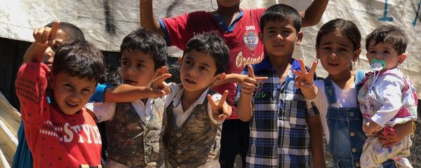 Сирийские беженцы в палаточном лагере в центральном Бекаа в поселении Каб Эльяс (11 августа 2018). Ливан Сирийские беженцы в палаточном лагере в центральном Бекаа в поселении Каб Эльяс (11 августа 2018). Ливан - Sputnik Արմենիա