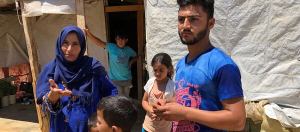 Сирийские беженцы в палаточном лагере в центральном Бекаа в поселении Каб Эльяс (11 августа 2018). Ливан - Sputnik Армения