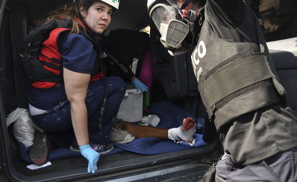 Раненый в столкновении с Национальной гвардией Венесуэлы в Альтамире, районе Каракаса - Sputnik Армения