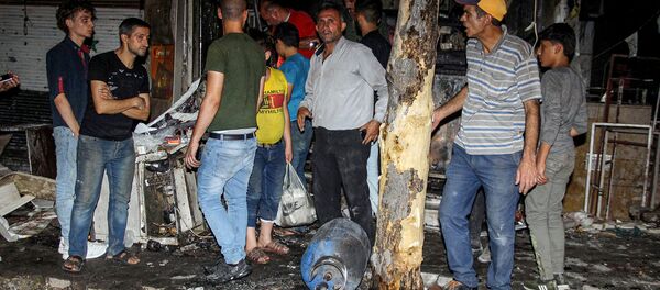 Последствия ракетно-артиллерийского обстрела в жилом районе в Алеппо (22 июля 2019). Сирия - Sputnik Армения