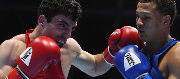 Ованес Бачков (Армения) и Леонель Де Лос Сантос (Доминиканская Республика) в поединке 1/4 финала по боксу на ХХ чемпионате мира по боксу (18 сентября 2019). Екатеринбург Ованес Бачков (Армения) и Леонель Де Лос Сантос (Доминиканская Республика) в поединке 1/4 финала по боксу на ХХ чемпионате мира по боксу (18 сентября 2019). Екатеринбург - Sputnik Արմենիա