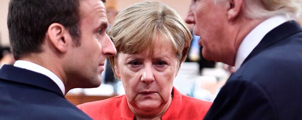 Президент США Дональд Трамп, канцлер Германии Ангела Меркель и президент Франции Эммануэль Макрон в беседе во время первой рабочей сессии саммита G-20 (7 июля 2017). Гамбург - Sputnik Արմենիա