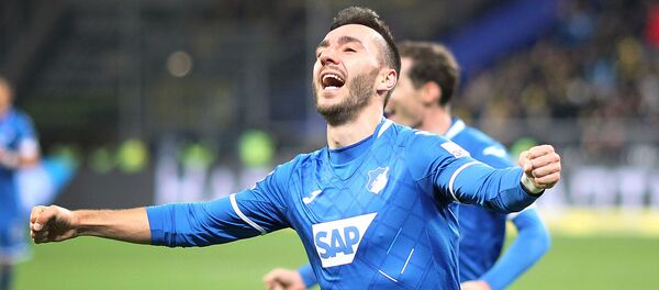 Армянский нападающий Хоффенхайма Саркис Адамян празднует забитый гол в матче первого дивизиона немецкой футбольной Бундеслиги против дортмундской Боруссии (20 декабря 2019). Зинсхайм - Sputnik Армения
