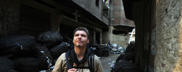 Фотокорреспондент Андрей Стенин на улице Каира Фотокорреспондент Андрей Стенин на улице Каира - Sputnik Армения