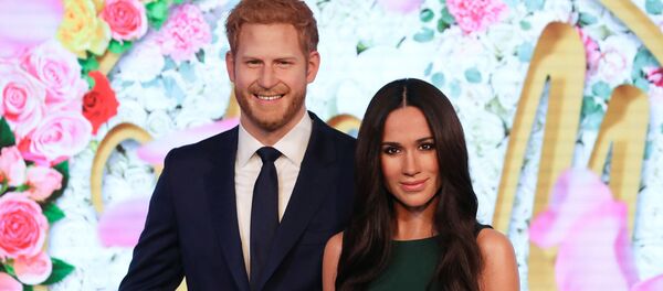 Восковые фигуры британского принца Гарри и Меган Маркл в Музее мадам Тюссо в Лондонe - Sputnik Արմենիա