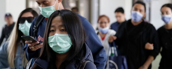 Пассажиры из Китая в медицинских масках в Международном аэропорту Манилы (23 января 2020). Филиппины - Sputnik Արմենիա