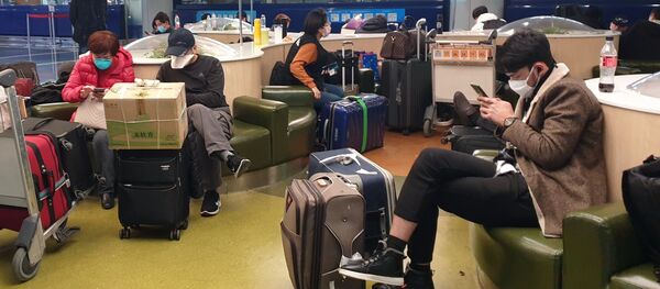 Туристы в аэропорту Шоуду в Пекине - Sputnik Армения