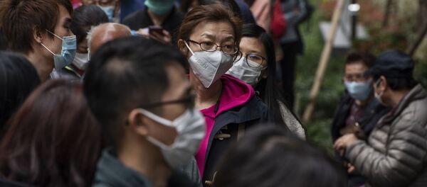 Очередь за защитными масками на одной из улиц в Гонконге. Очередь за защитными масками на одной из улиц в Гонконге. - Sputnik Армения