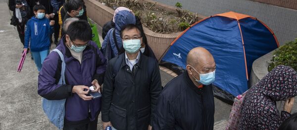 Очередь за защитными масками на одной из улиц в Гонконге. - Sputnik Армения