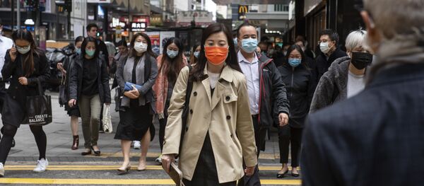 Прохожие в защитных масках на одной из улиц в Гонконге. Прохожие в защитных масках на одной из улиц в Гонконге. - Sputnik Արմենիա