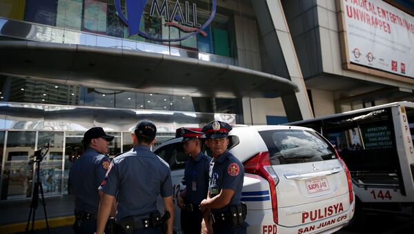 Полицейские на улице, где были произведены выстрелы в городе (2 марта 2020). Манила, Филиппины - Sputnik Армения