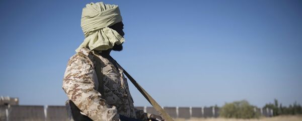 Боец ливийской национальной армии, лояльной Халифе Хафтару (28 апреля 2019). Триполи Боец ливийской национальной армии, лояльной Халифе Хафтару (28 апреля 2019). Триполи - Sputnik Армения