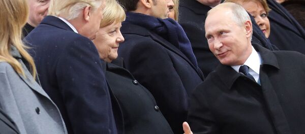 Лидеры России, США и Германии Владимир Путин, Ангела Меркель и Дональд Трампом во время празднования 100-летия окончания Первой мировой войны (11 ноября 2018). Париж - Sputnik Армения