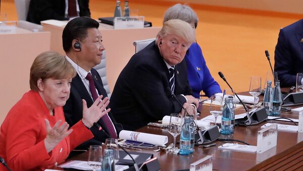 Лидеры Германии, Китая, США и Великобритании во время рабочей сессии в первый день саммита G-20 (7 июля 2017). Гамбург - Sputnik Армения