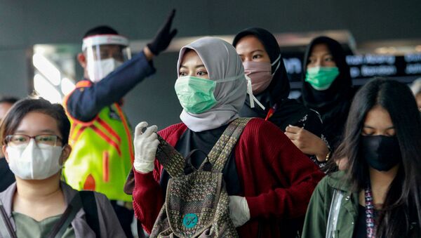 Люди в защитных масках (9 июня 2020). Джакарта, Индонезия - Sputnik Արմենիա
