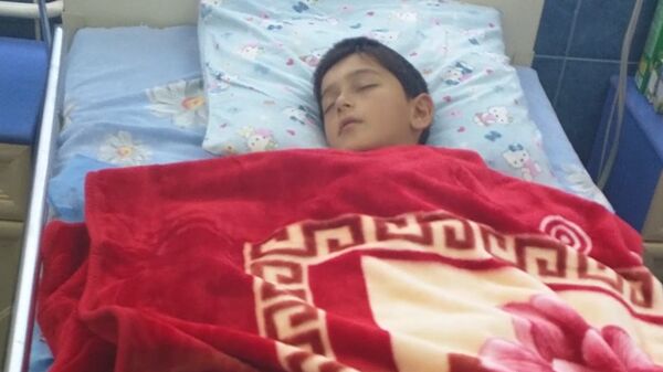 Мальчик, пострадавший в результате обстрела - Sputnik Армения