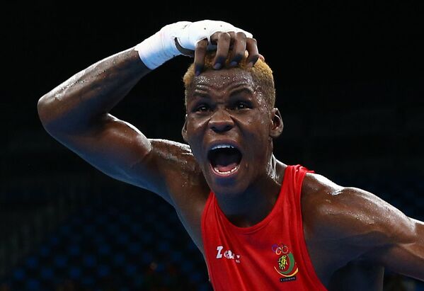 Боксер Вилфред Нтсенгуе из Камеруна после победы в бою на XXXI летних Олимпийских играх - Sputnik Армения