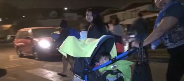 Спутник_Люди с детьми и животными вышли из домов на улицы после землетрясения в Чили Спутник_Люди с детьми и животными вышли из домов на улицы после землетрясения в Чили - Sputnik Армения